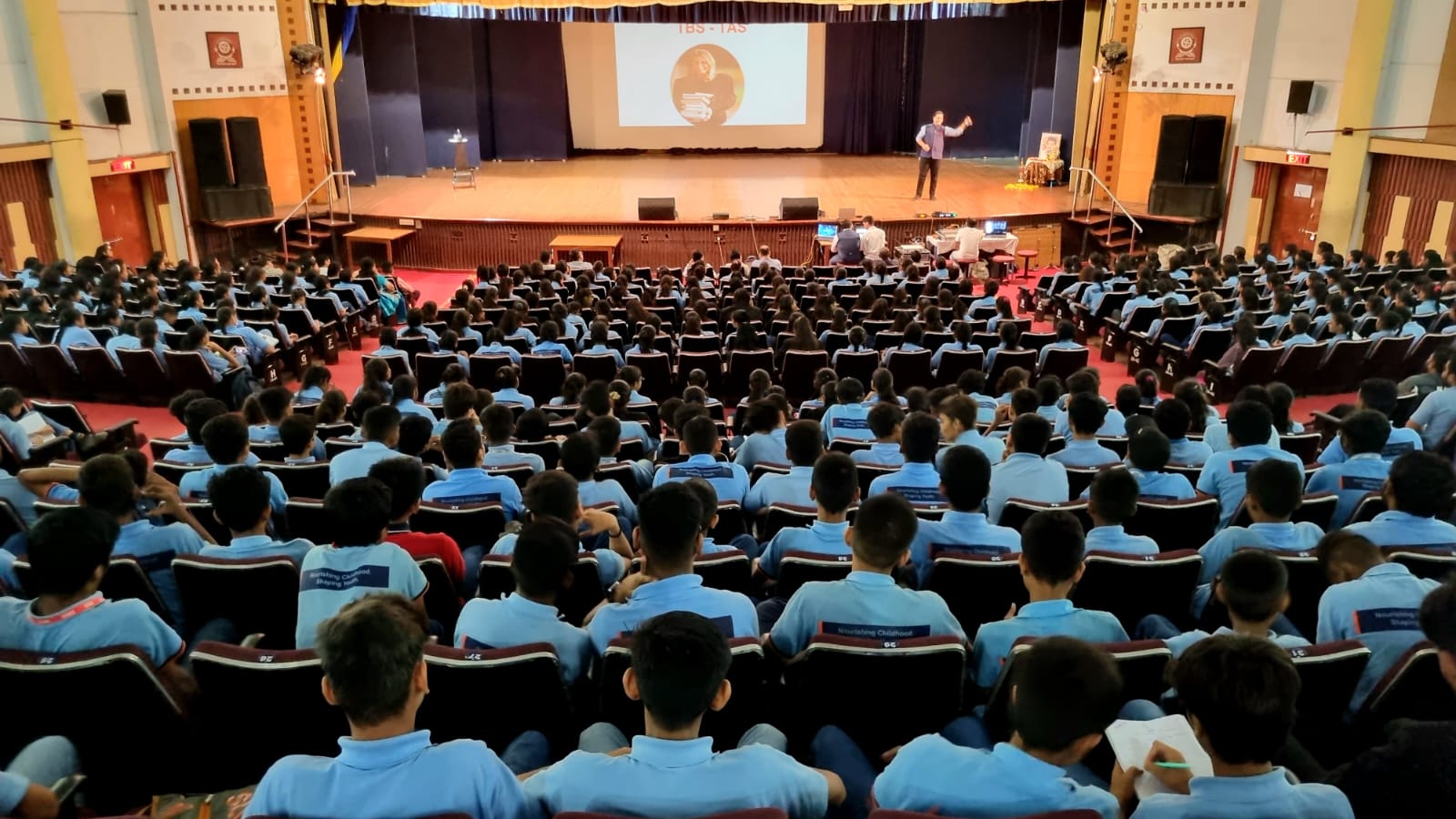 Parikshit Jobanputra addressing 1,000+ students at a school auditorium in India
