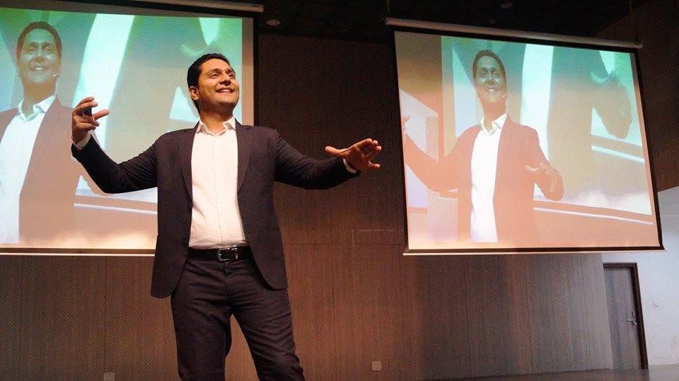 Parikshit Jobanputra on stage during a parenting coach training program in India